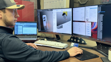 a design development engineer at SSI custom plastics views a design file on his computer